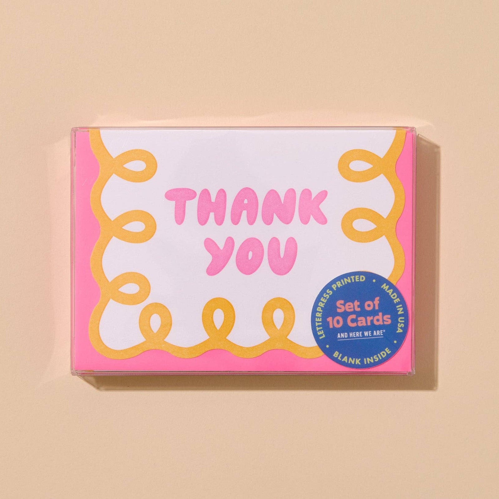 Pink and yellow 'Thank You' cards with decorative patterns.