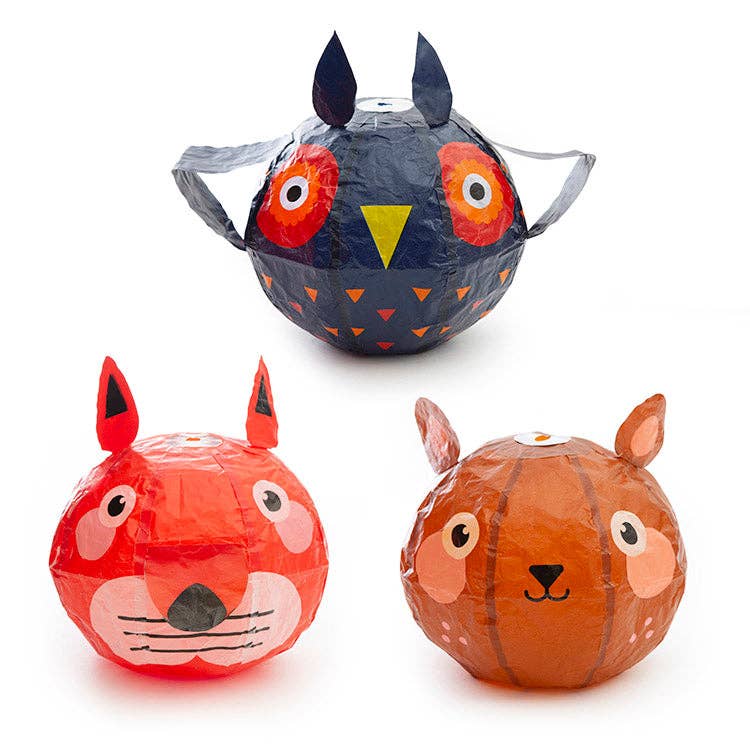 Three animal-themed paper lanterns shaped like a fox, owl, and rabbit on a white background.