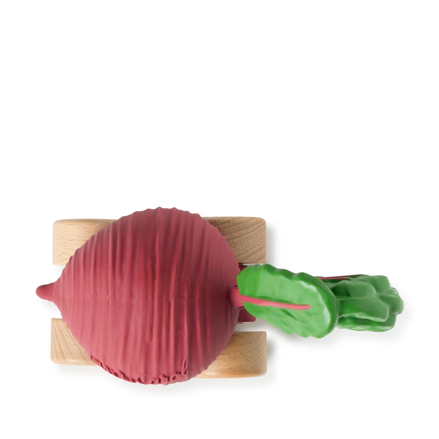 Toy beetroot with wooden wheels on a white background