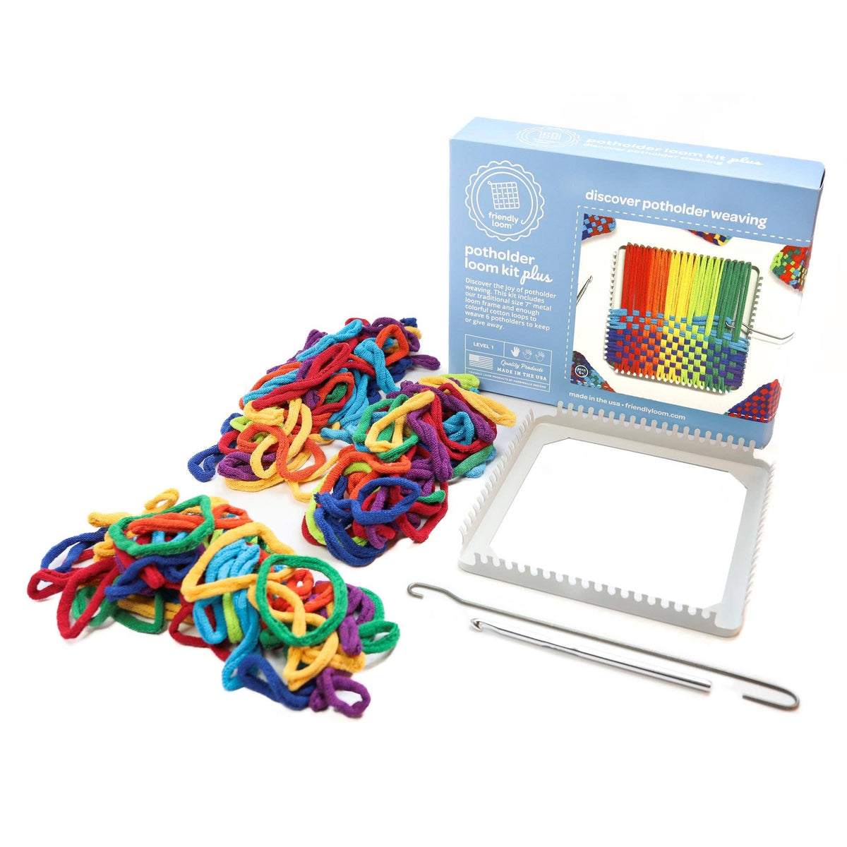 Colorful loom bands with a loom and packaging on a white background