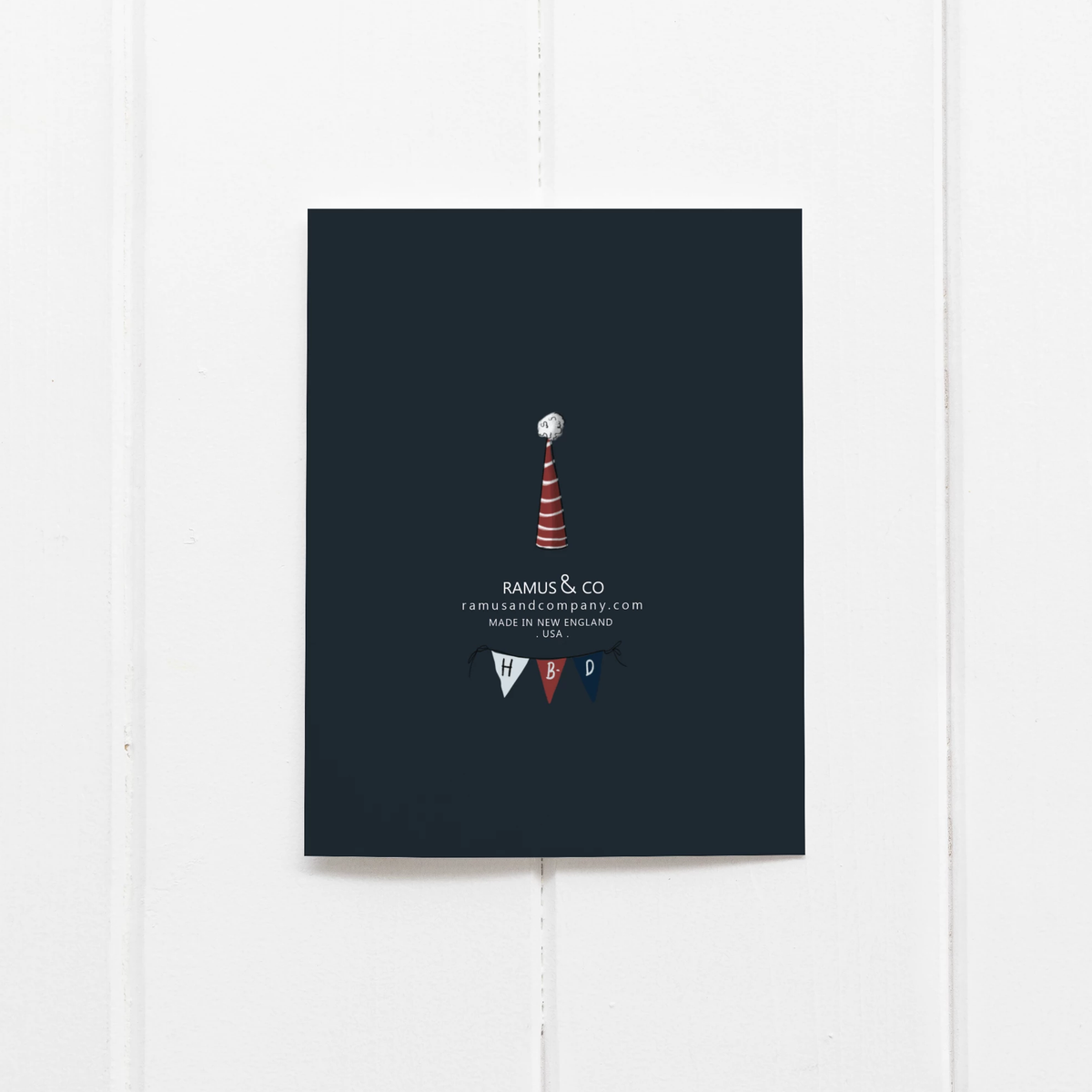 Navy blue card with a lighthouse design and text on a white background