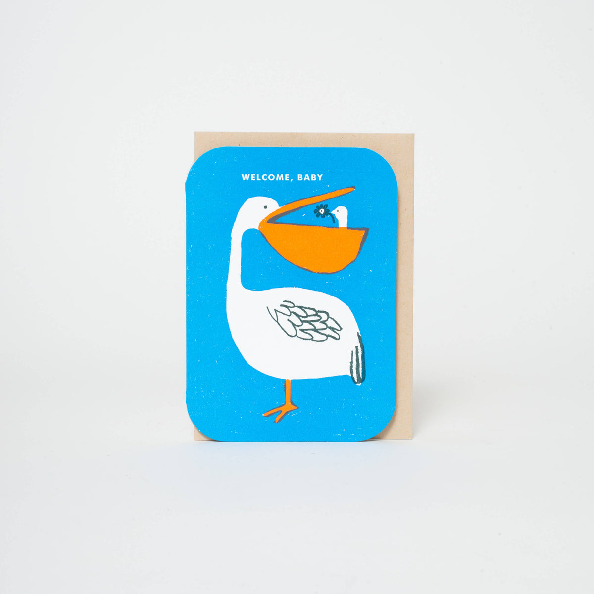 Greeting card with a pelican illustration and 'Welcome, Baby' text on a blue background.