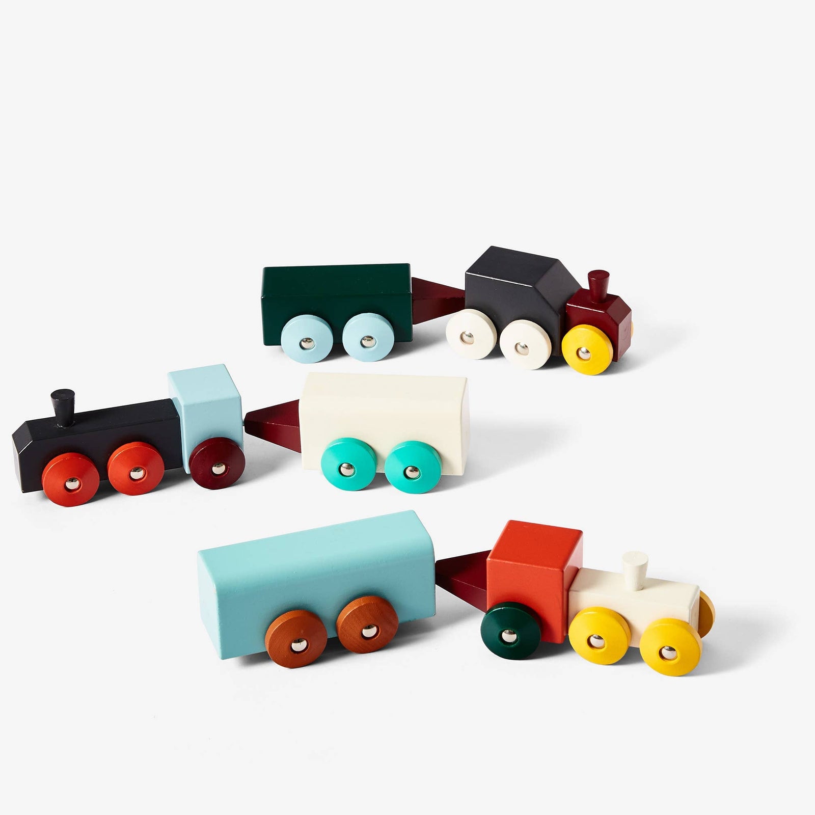 Set of colorful wooden toy train cars on a white background