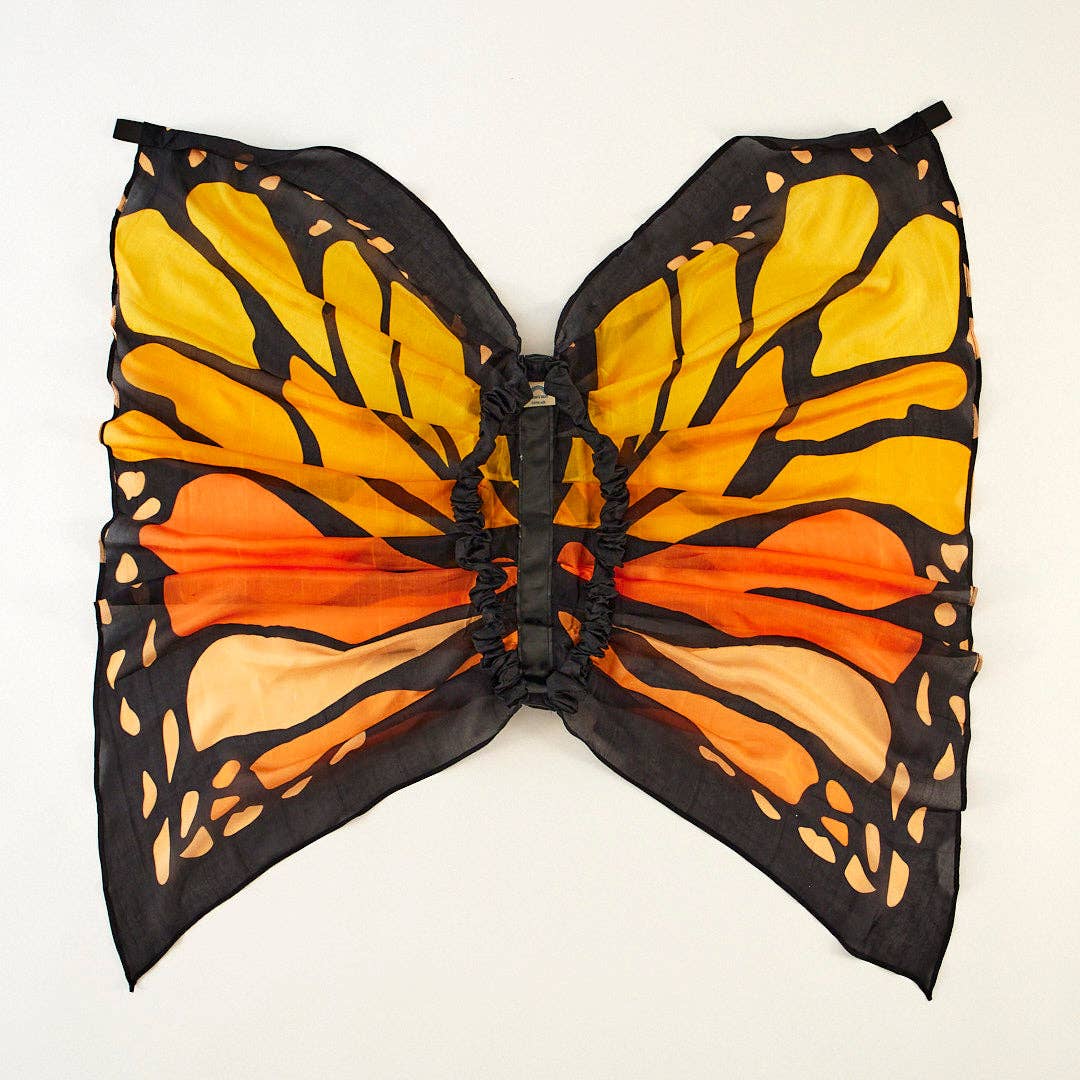 Butterfly costume wings with orange, black, and yellow pattern on a white background