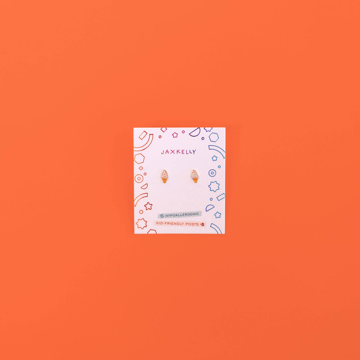 Jewelry card with earrings on an orange background