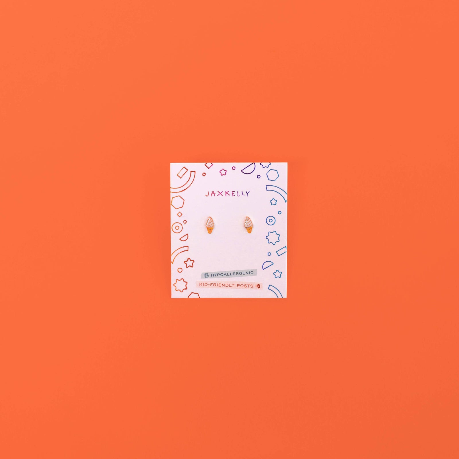 Jewelry card with earrings on an orange background