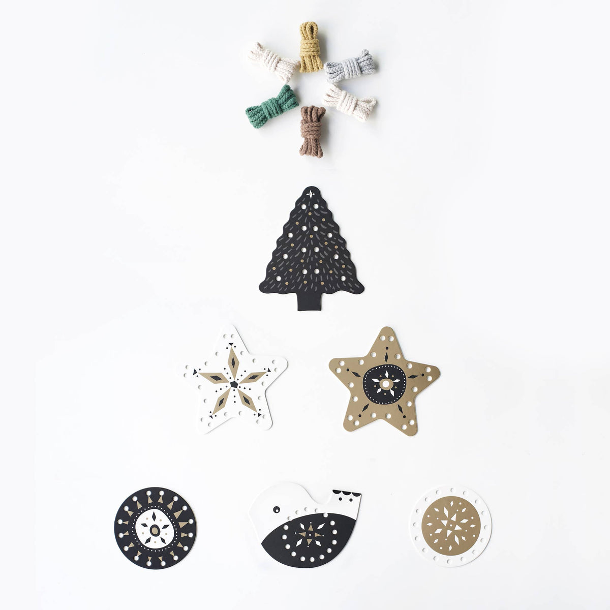 Set of decorative Christmas tree, star, snowflake, and bird ornaments on a white background.