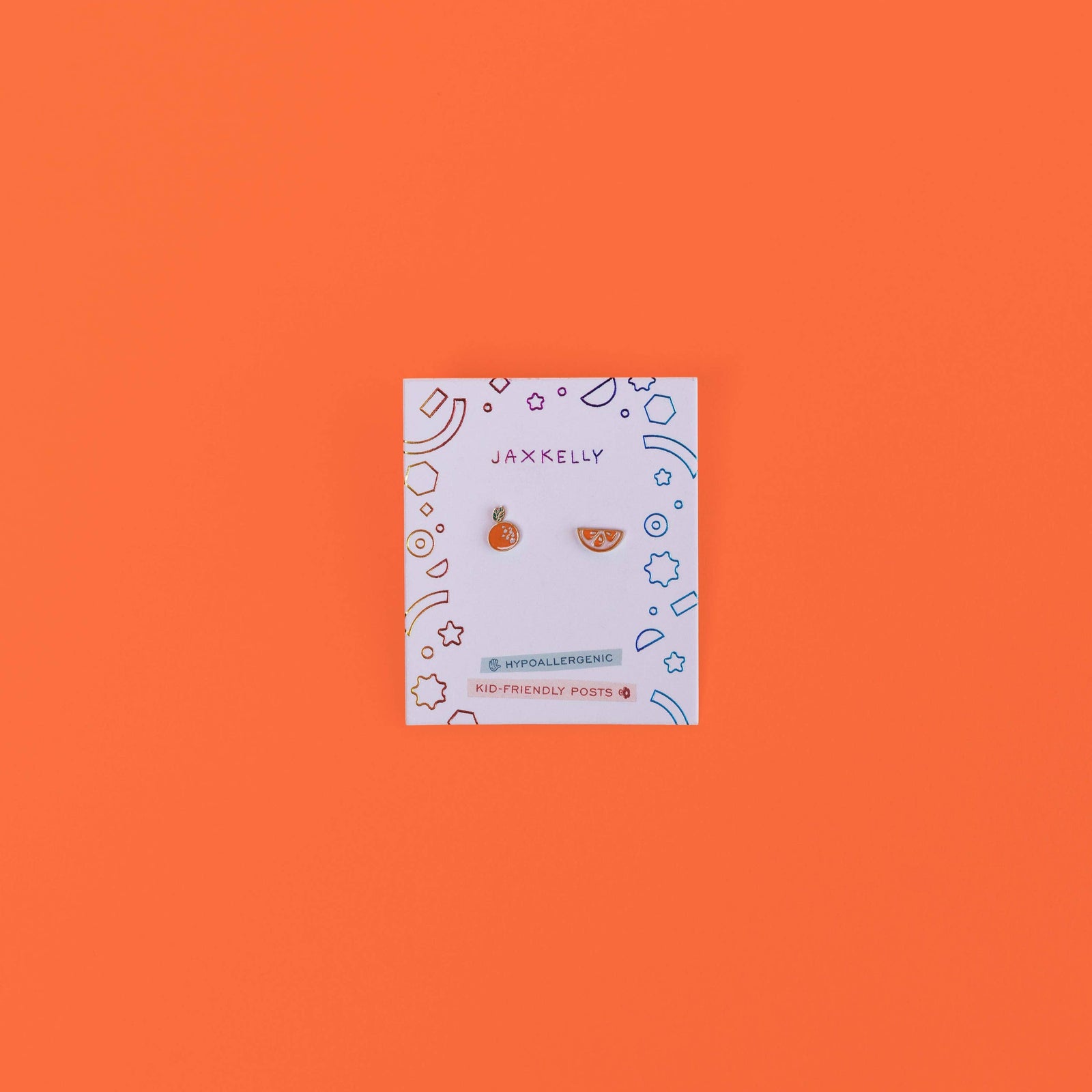 Jewelry card with earrings on an orange background