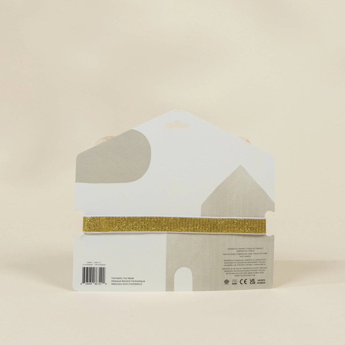 Fox shaped product packaging with gold band on a beige background
