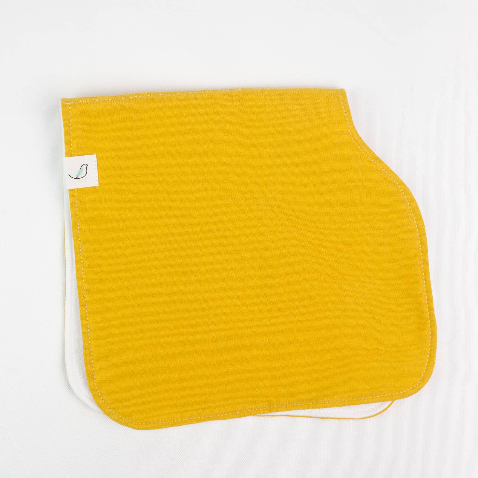Yellow burp cloth with 'hemming birds' label on a white background