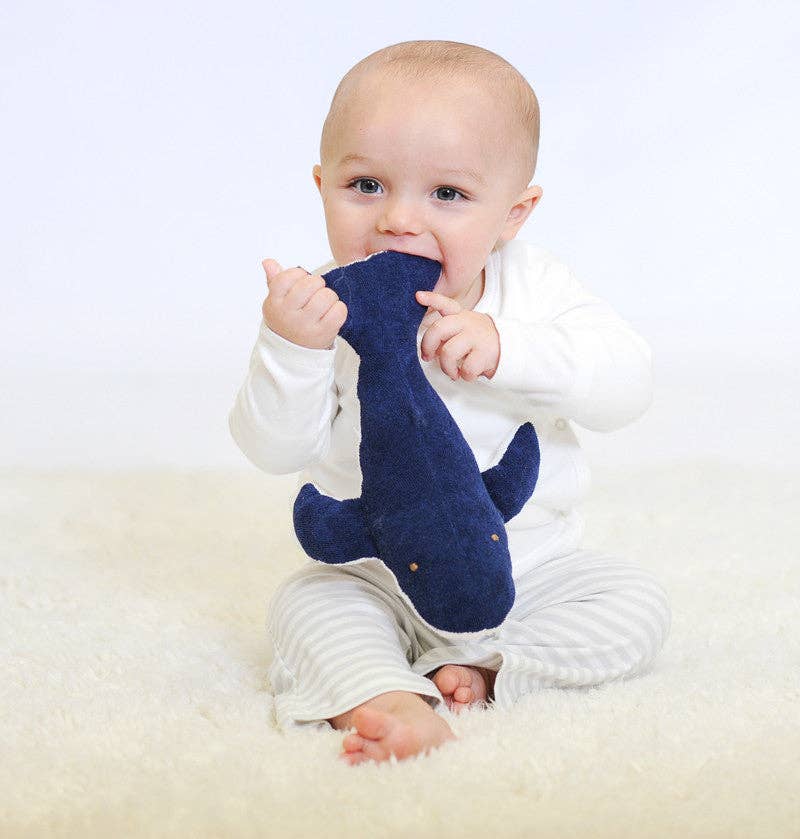 Blue and white whale-shaped plush toy on a white background