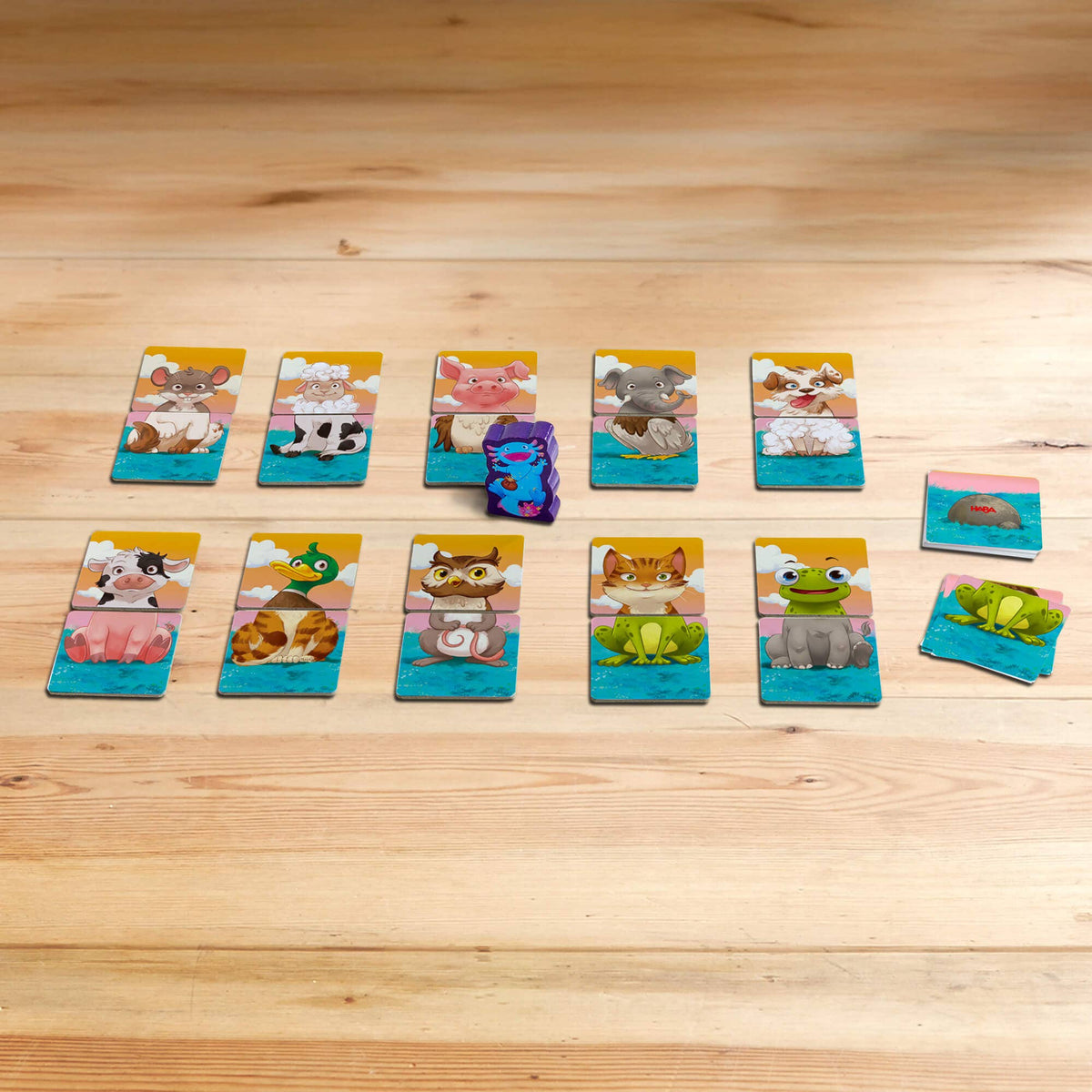 Set of animal-themed cards on a wooden surface