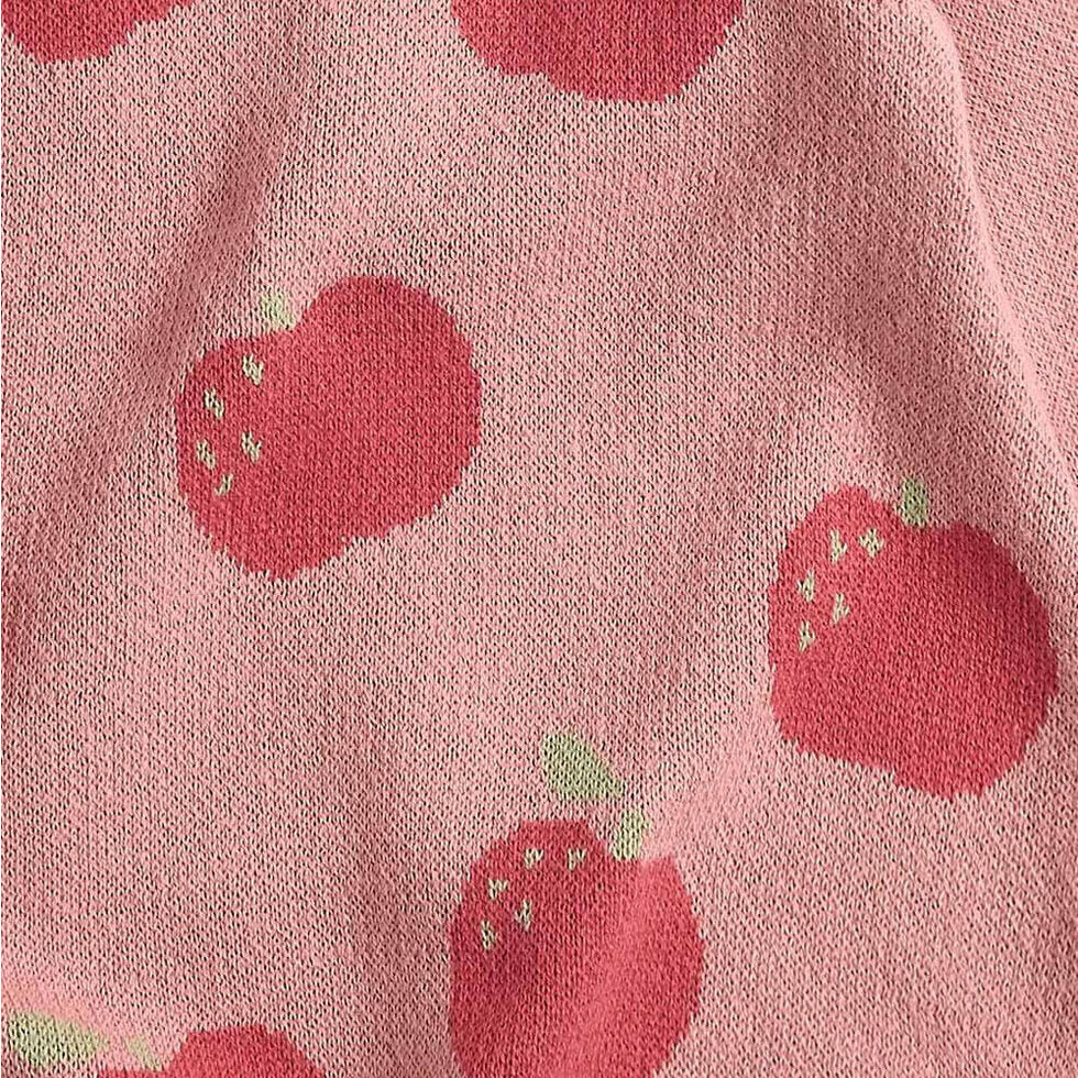 Pink fabric with red apple pattern