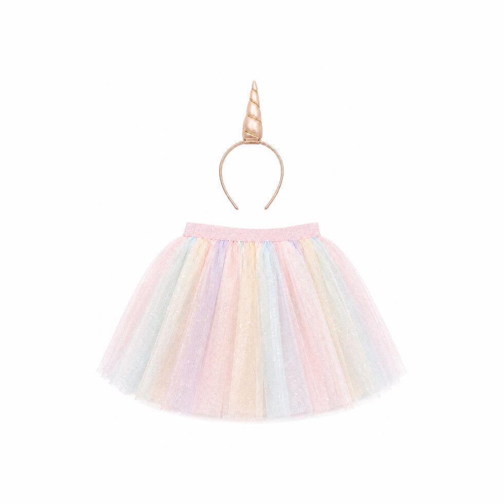 A pastel glittery tulle tutu skirt in pink, yellow, blue, and purple, paired with a gold unicorn horn headband, shown on a plain white background.