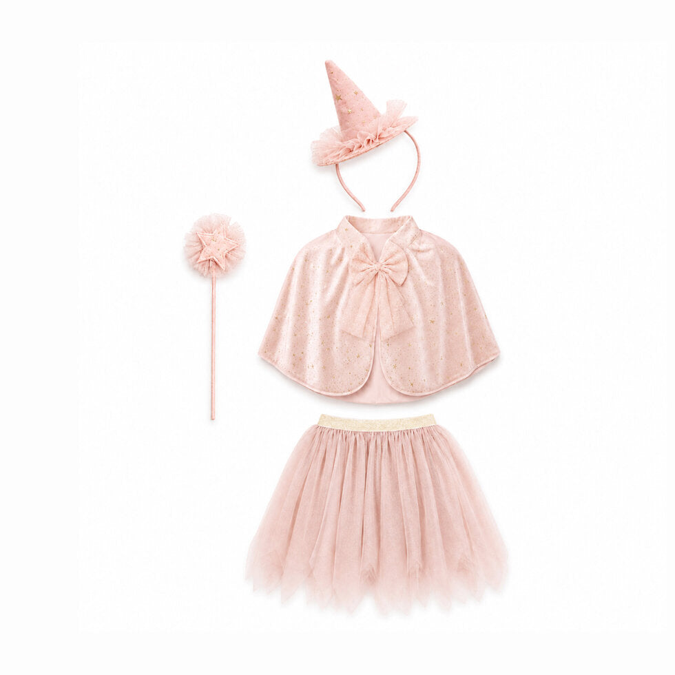 A children's pink costume set laid out on a white background, including a tulle tutu skirt, a sparkly cape with a bow, a pointed hat, and a wand with a pom-pom.