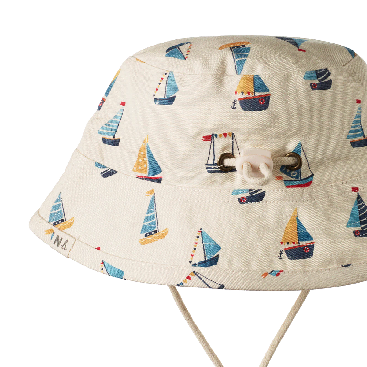 Children's sun hat with sailboat pattern on a white background