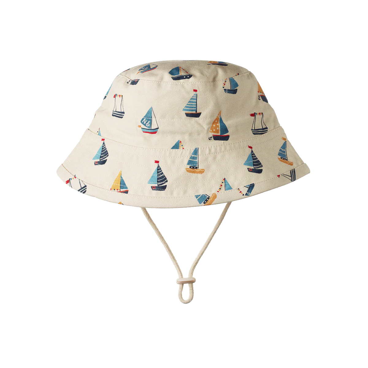 Beige bucket hat with sailboat pattern on a white background