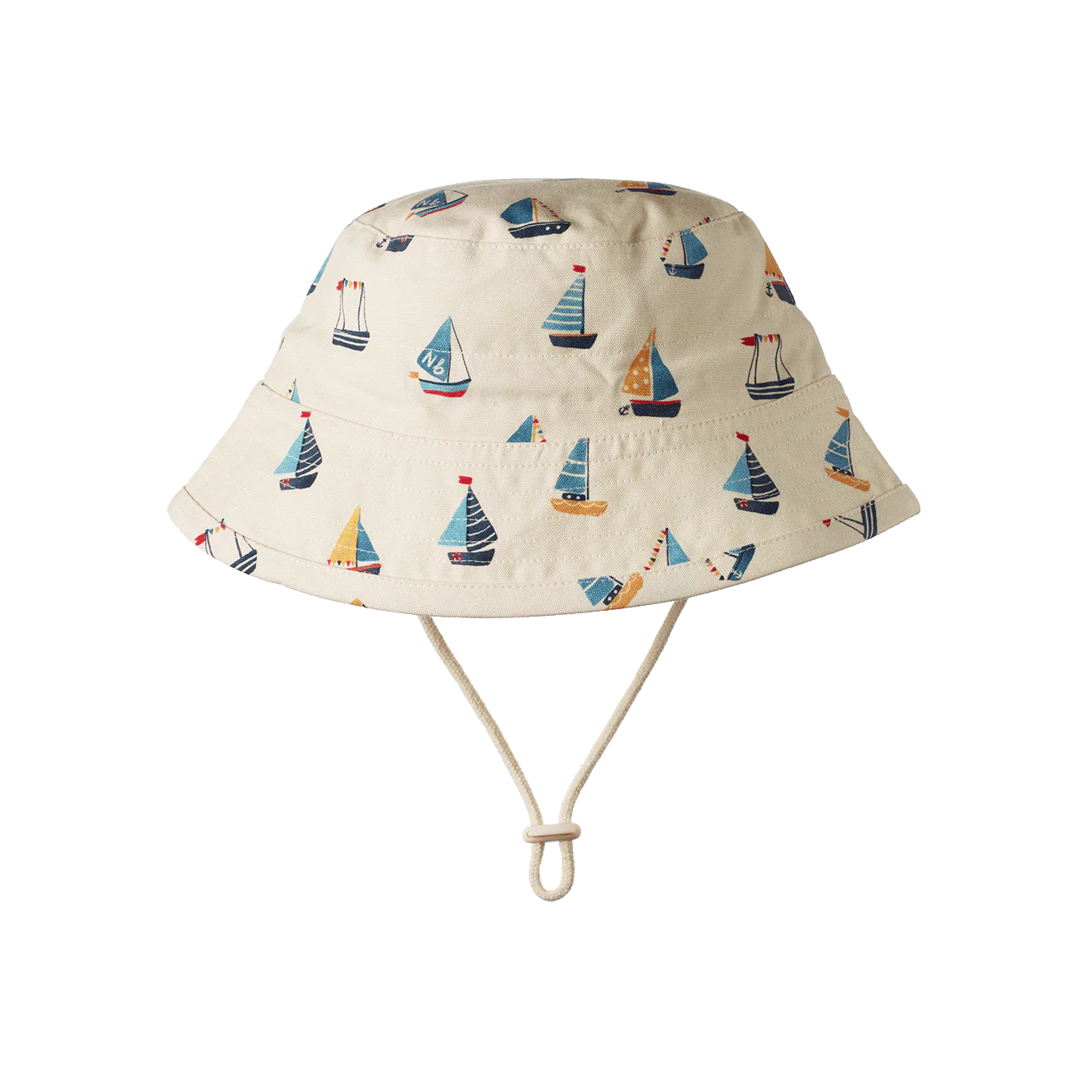 Baby wearing a patterned hat and shirt against a blue background