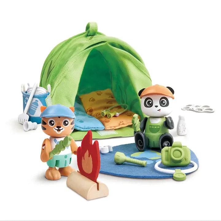 Two children playing with toy figures on a table.