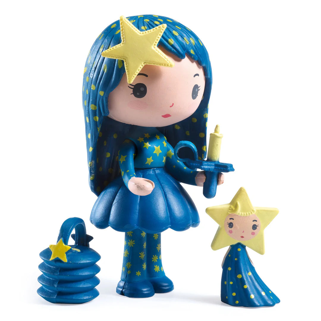 Toy figure with blue hair and dress, holding a star-shaped object on a white background