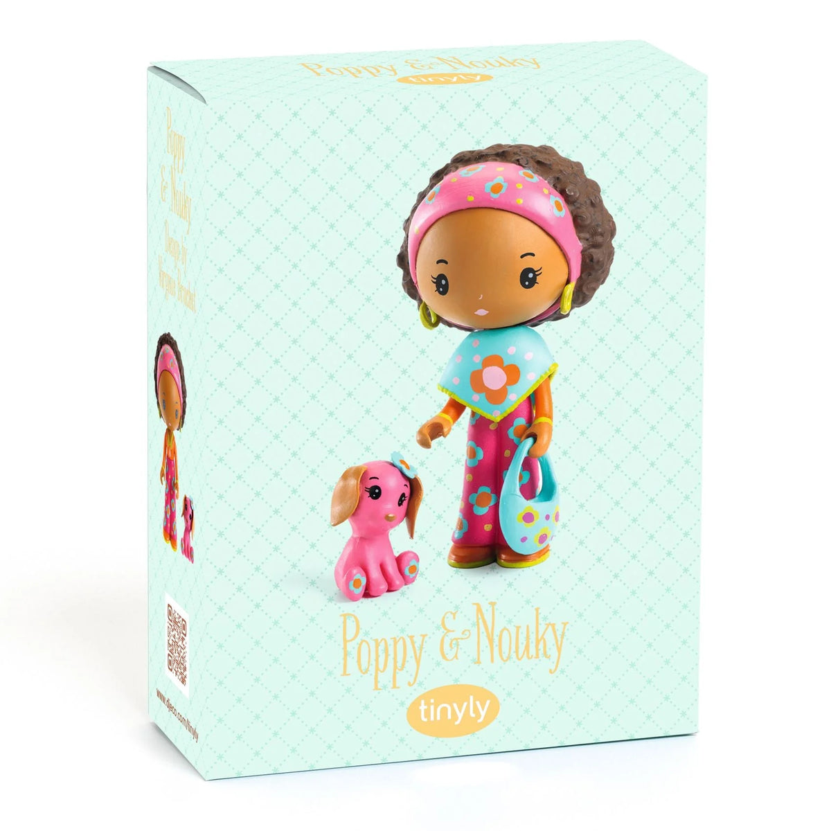 Toy figure with pink headband and outfit on a light blue box, featuring 'tinyly' branding.