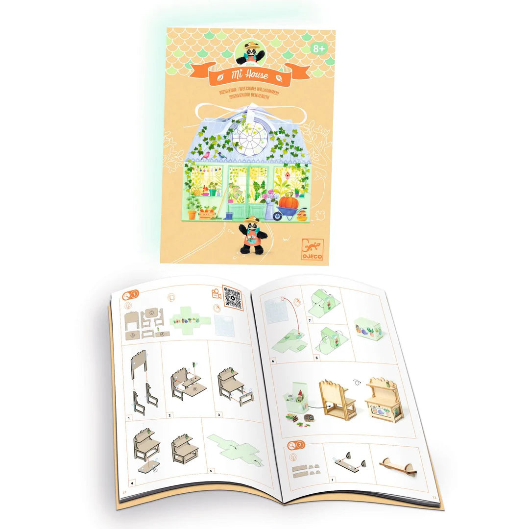 Children's activity book with illustrated house and furniture pieces on a white background