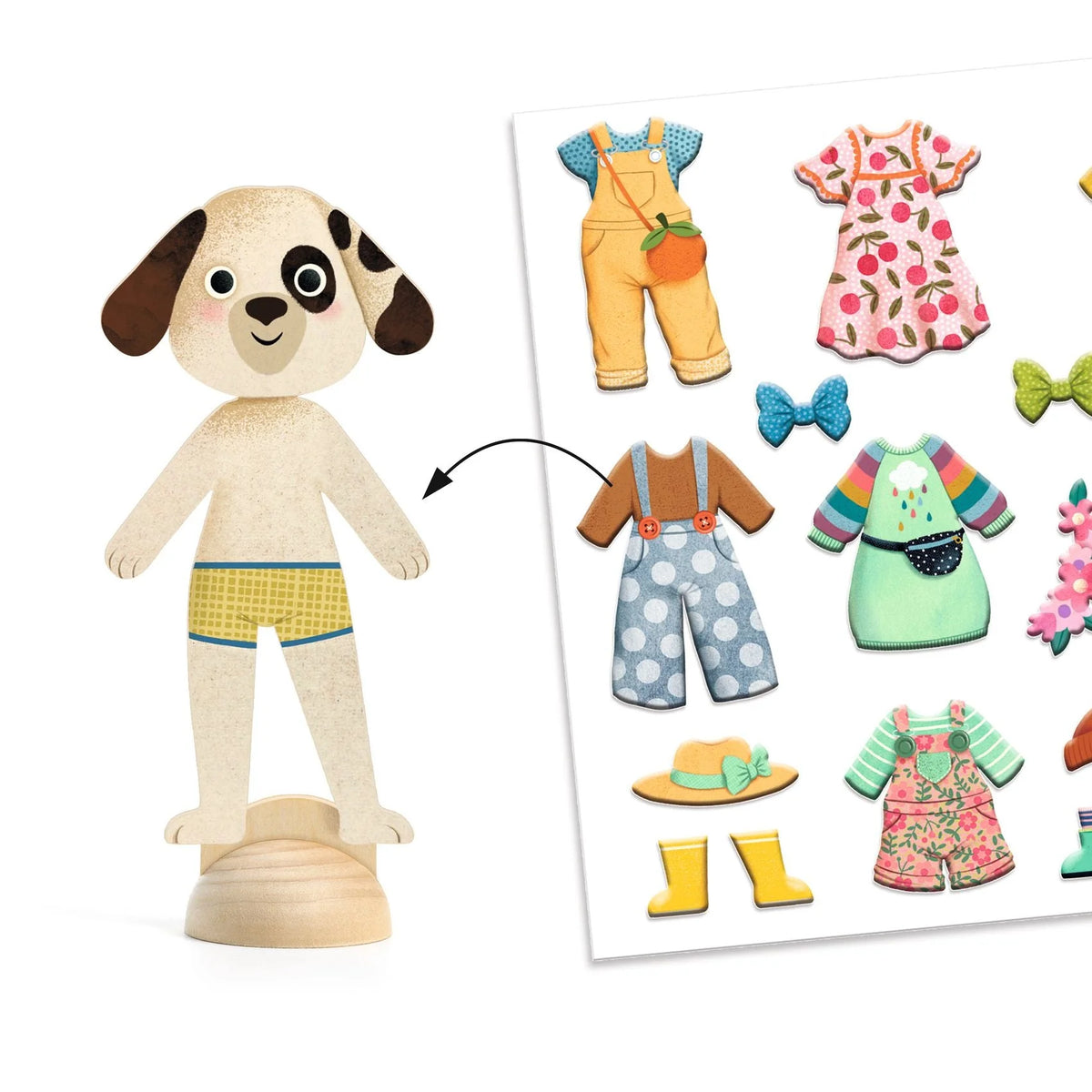 Toy dog with interchangeable clothes and accessories on a white background
