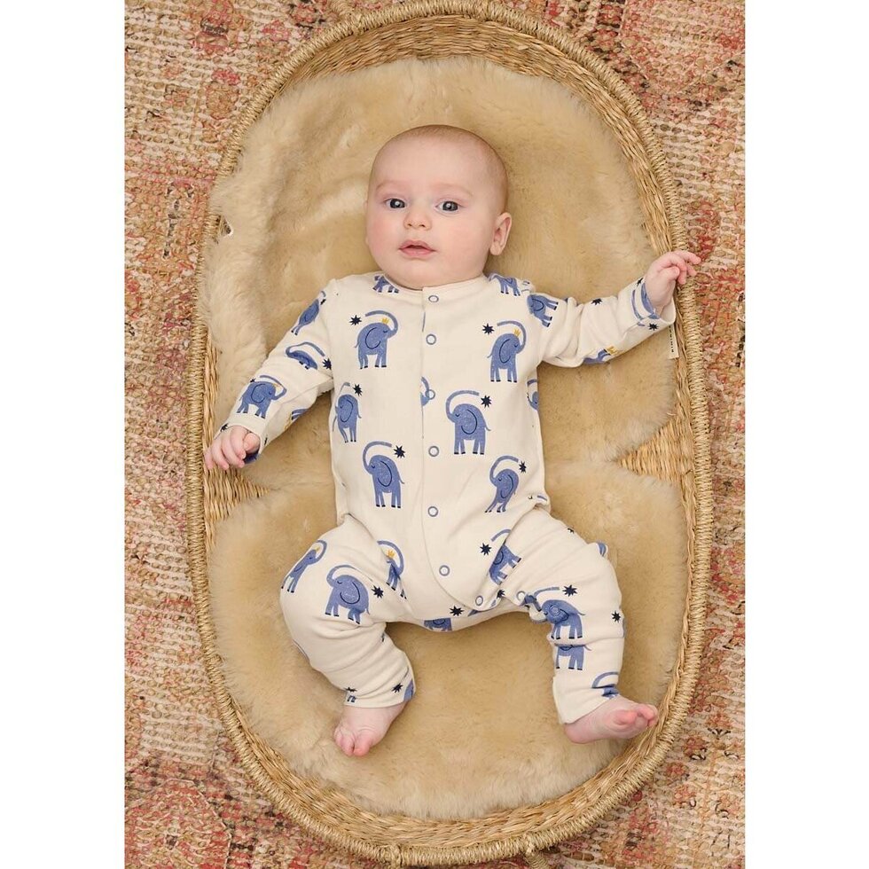 Baby onesie with blue elephant pattern on a white background