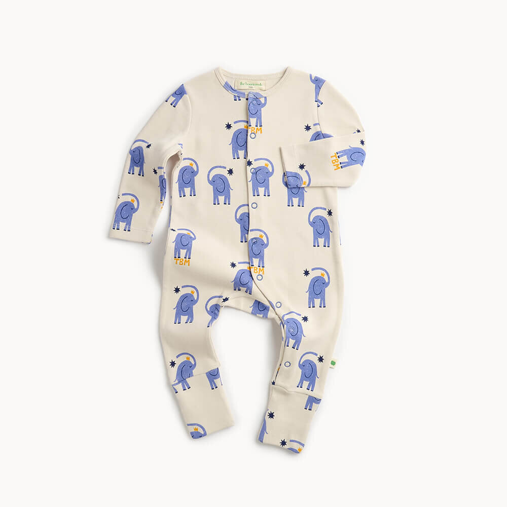 Baby onesie with blue elephant pattern on a white background