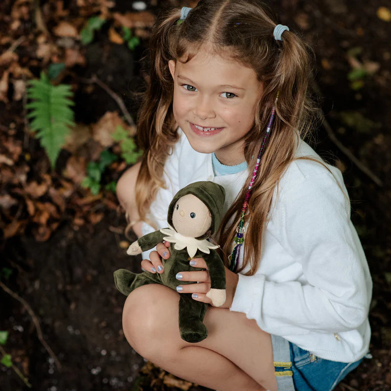 Stuffed toy dressed in green with acorns on a light background