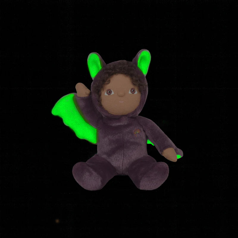 Plush toy in a purple costume with bat wings on a white background