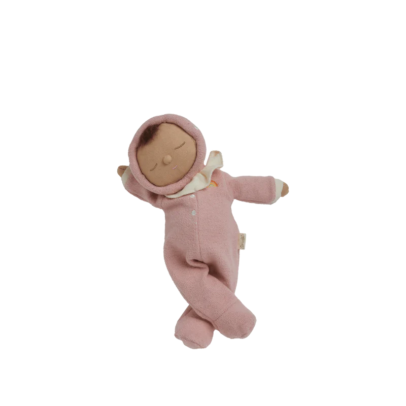 Pink baby doll with a white bow on a white background