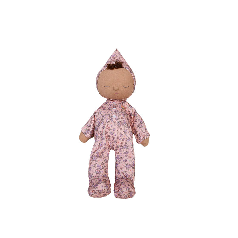 Stuffed doll in a floral outfit on a white background