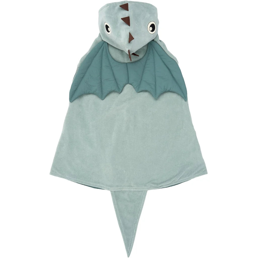 A plush dinosaur hooded cape for kids, featuring a light sage green body, darker teal wings, and a matching hood with a snout, eyes, and small brown spikes, shown on a plain white background.