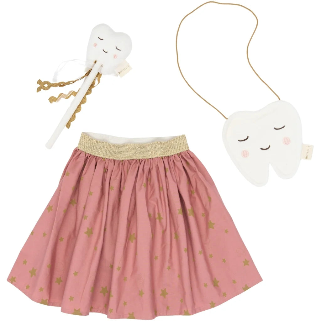 Pink skirt with gold star pattern, white tooth-shaped bag, and white tooth-shaped rattle on a white background