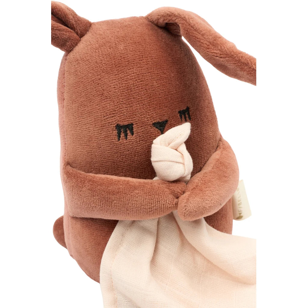 Plush bunny toy with a blanket on a white background
