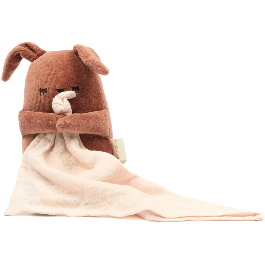 Plush bunny toy with a blanket on a white background