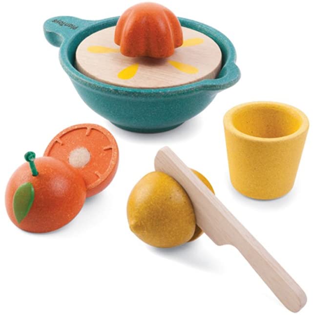 Set of wooden toys including an orange, lemon  bowl, and other items on a white background