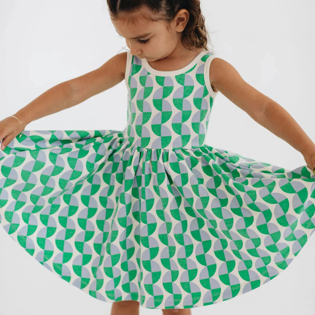 Green and white patterned dress on a white background