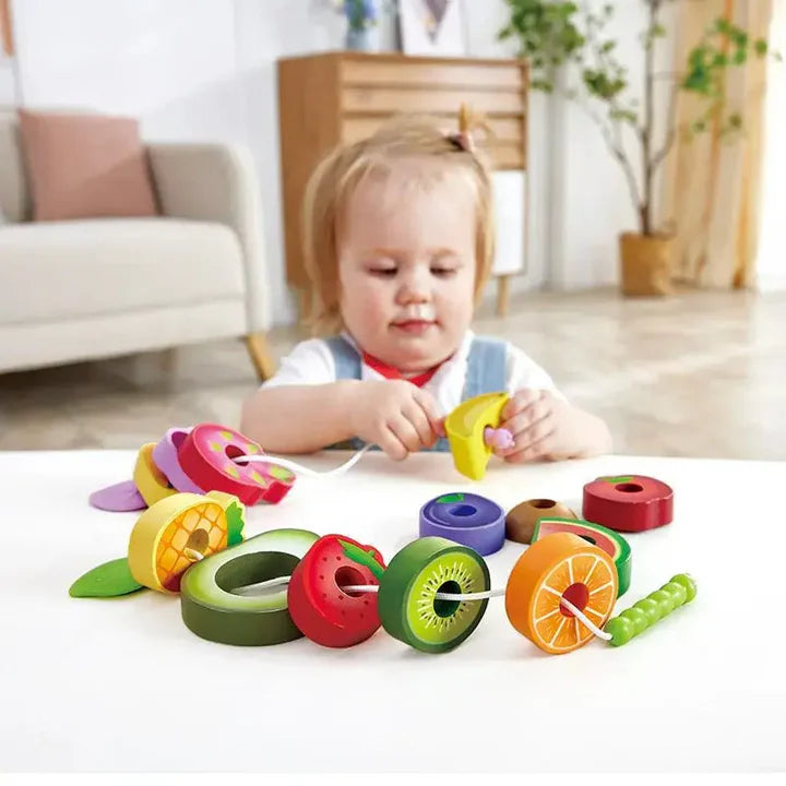 Colorful toy set with various shaped pieces on a white background