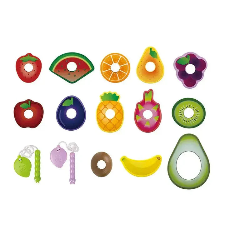Set of colorful fruit-shaped teething rings and toys on a white background