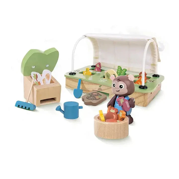 Child playing with a toy set outdoors on a sunny day