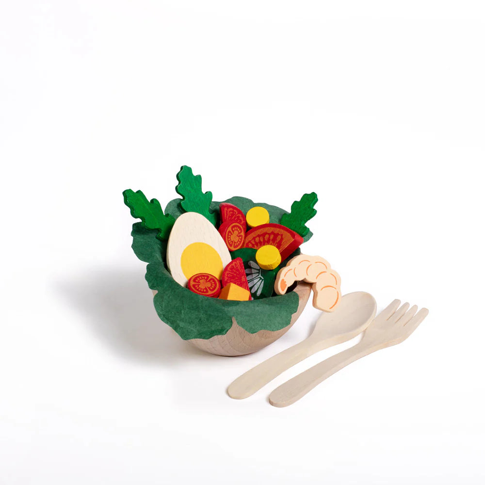 Toy salad bowl set with packaging on a white background