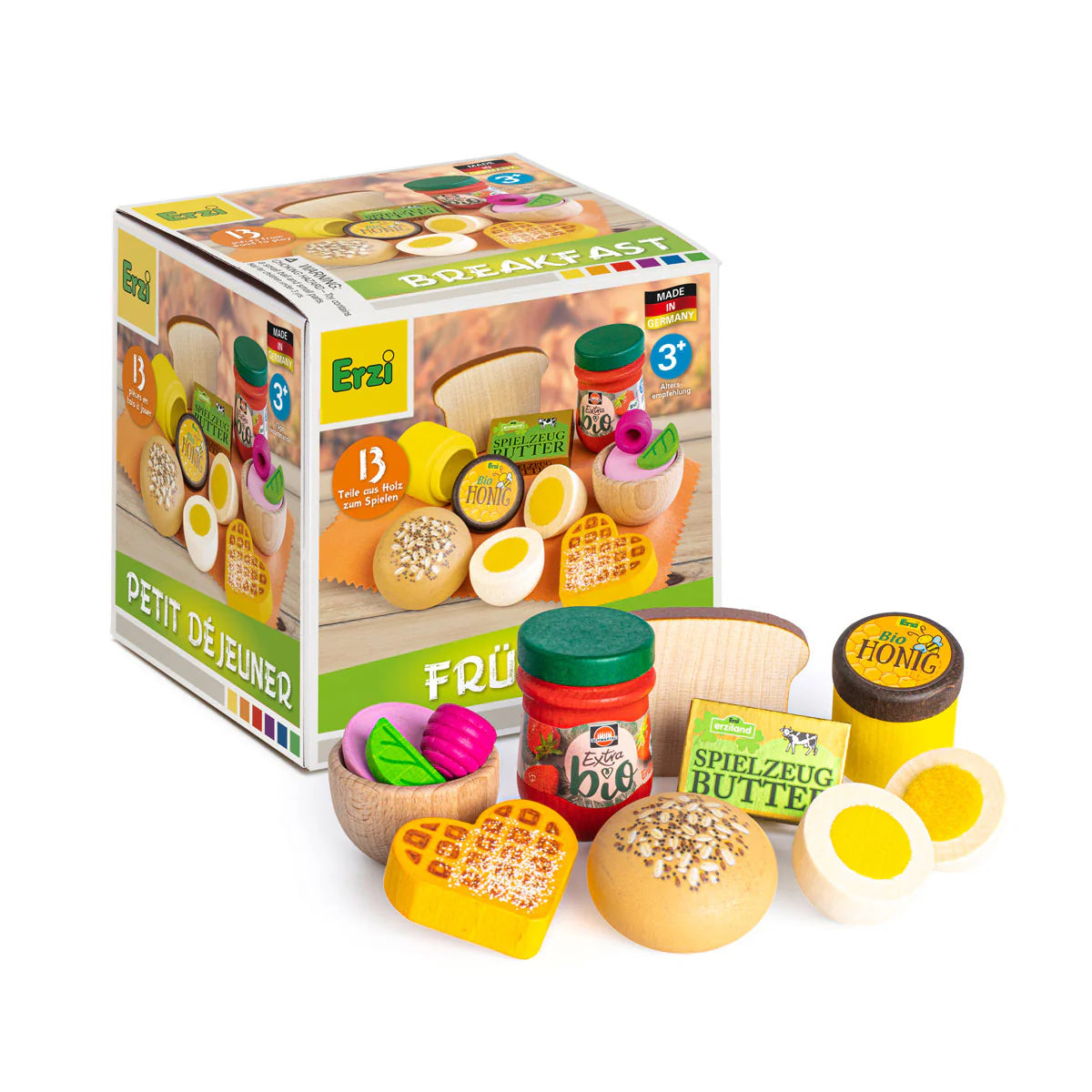 Toy food set with packaging labeled 'Erzi' on a white background