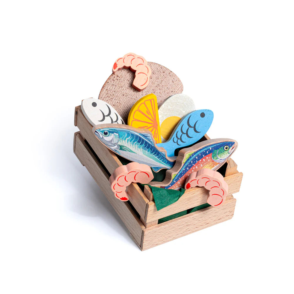 Wooden toy set with fish and shell design on a white background