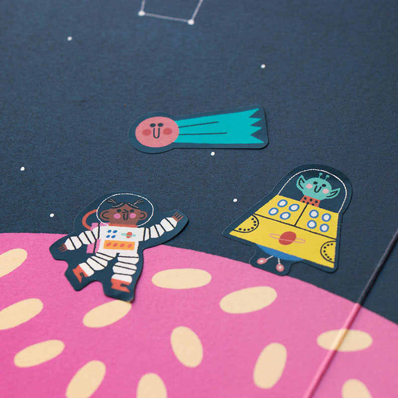 Colorful space-themed stickers on a pink and blue background