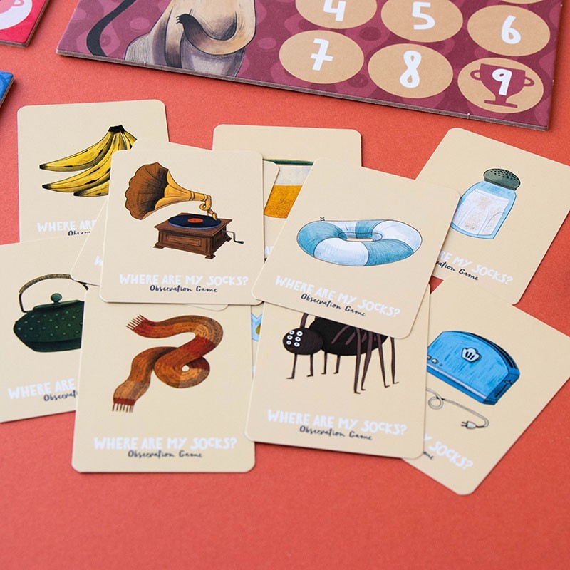 Set of illustrated cards with various objects and text on a red background