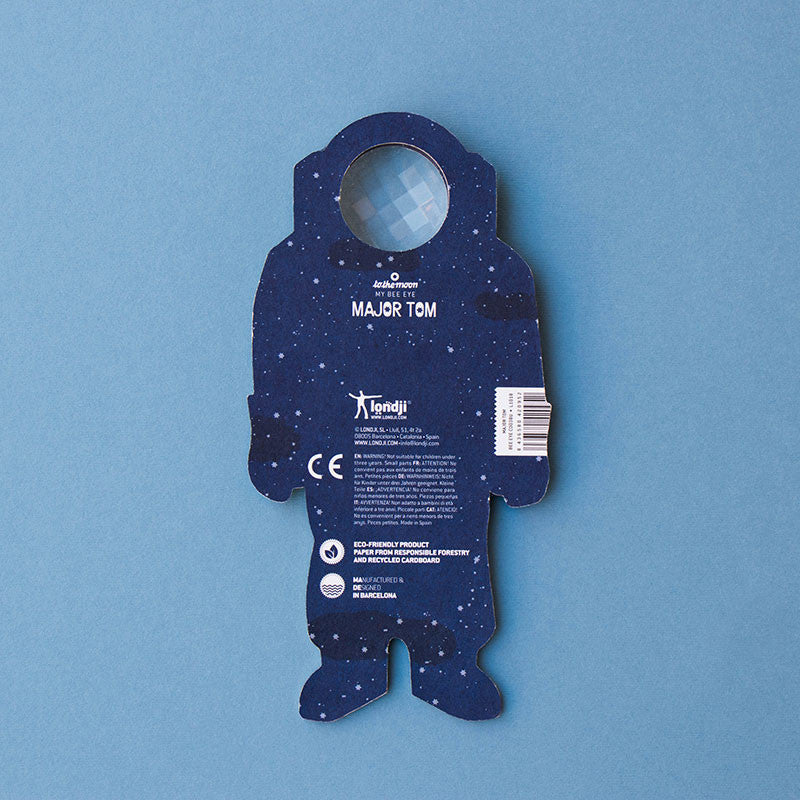 Blue astronaut-shaped packaging on a blue background