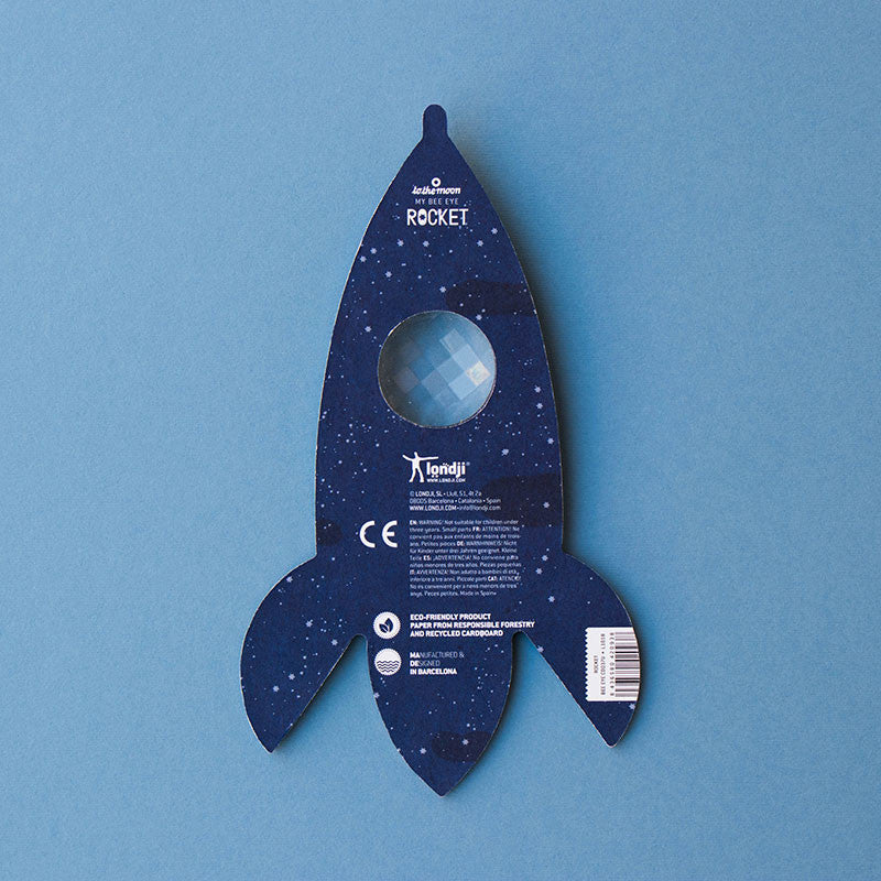 Toy rocket ship on a blue background