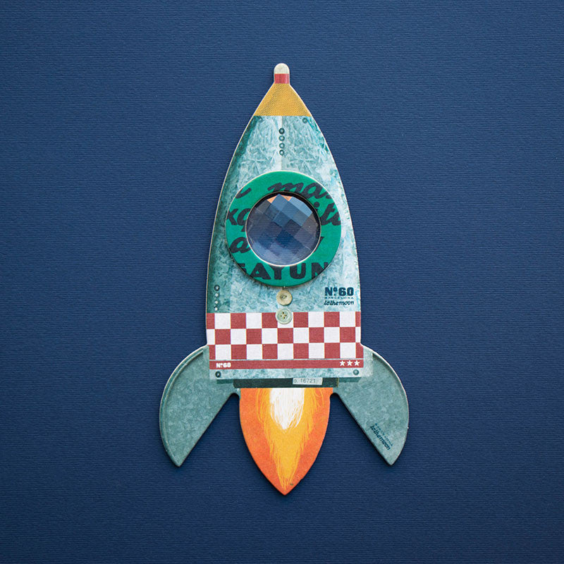 Toy rocket ship on a blue background